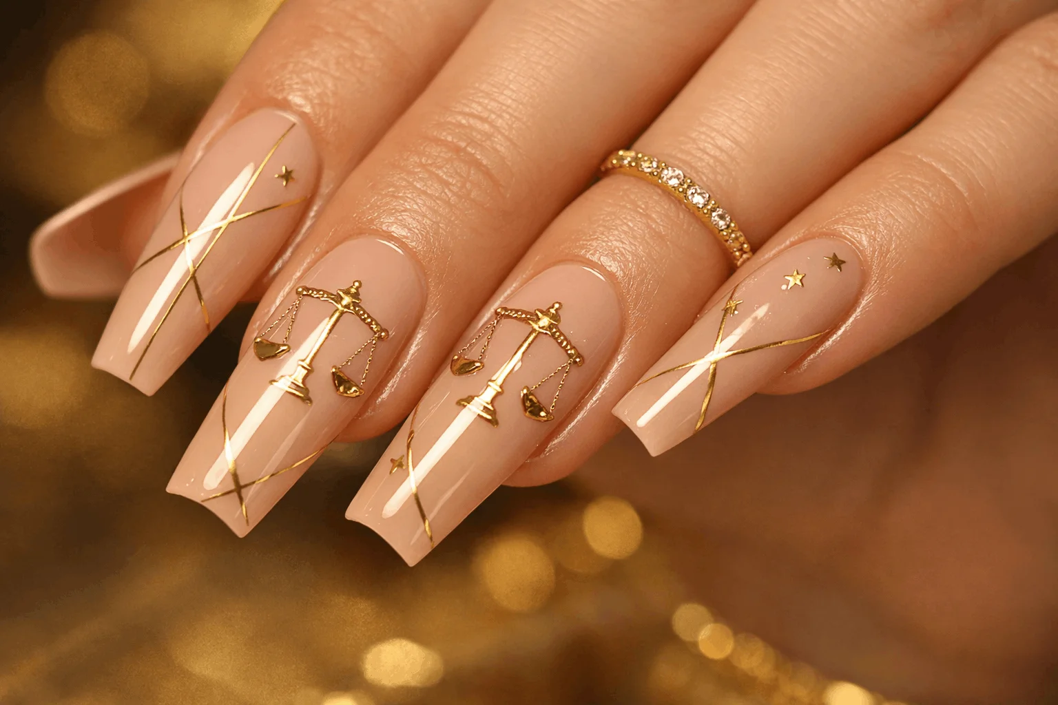 21 Libra Nails Designs for Soft, Chic Manicures 4 Nude and gold libra aesthetic nails with elegant zodiac nail art