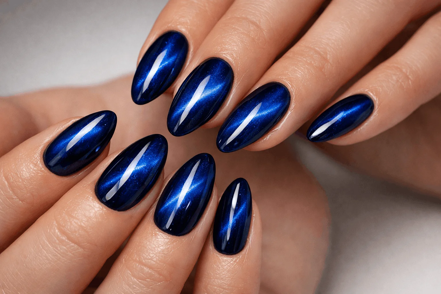 25 Blue Cat Eye Nails That Hit Different This Year 11 Blue cat eye nails with glitter accent design