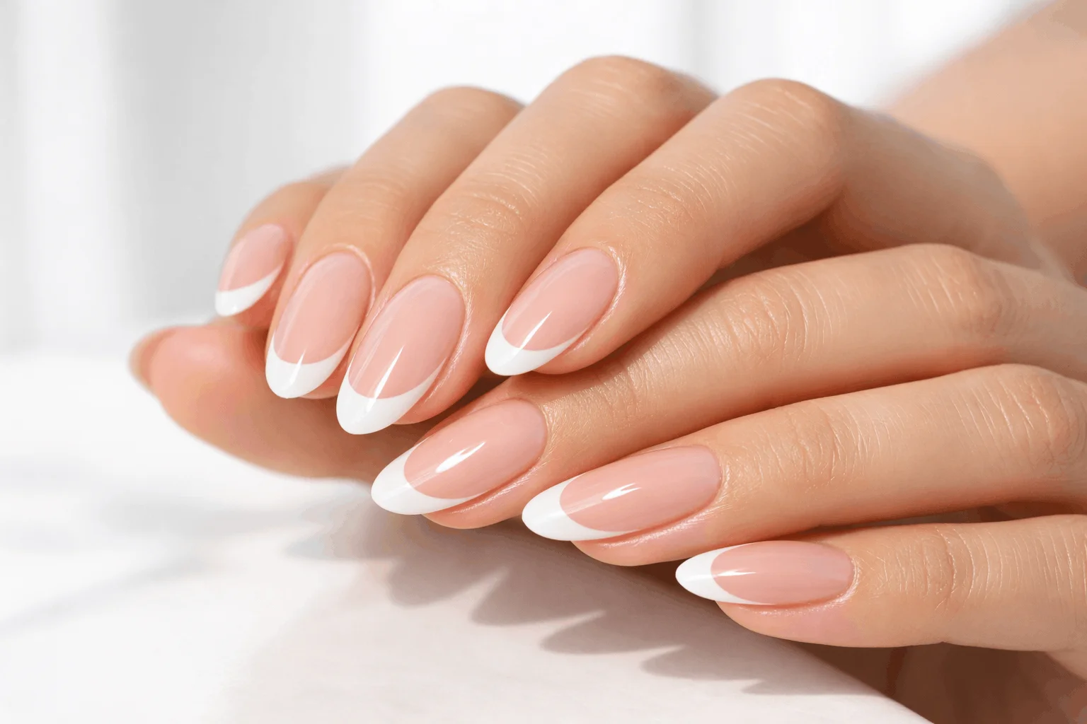 21 White French Tip Nails That Look Clean & Chic 1 Classic white french tip nails with glossy almond shape finish