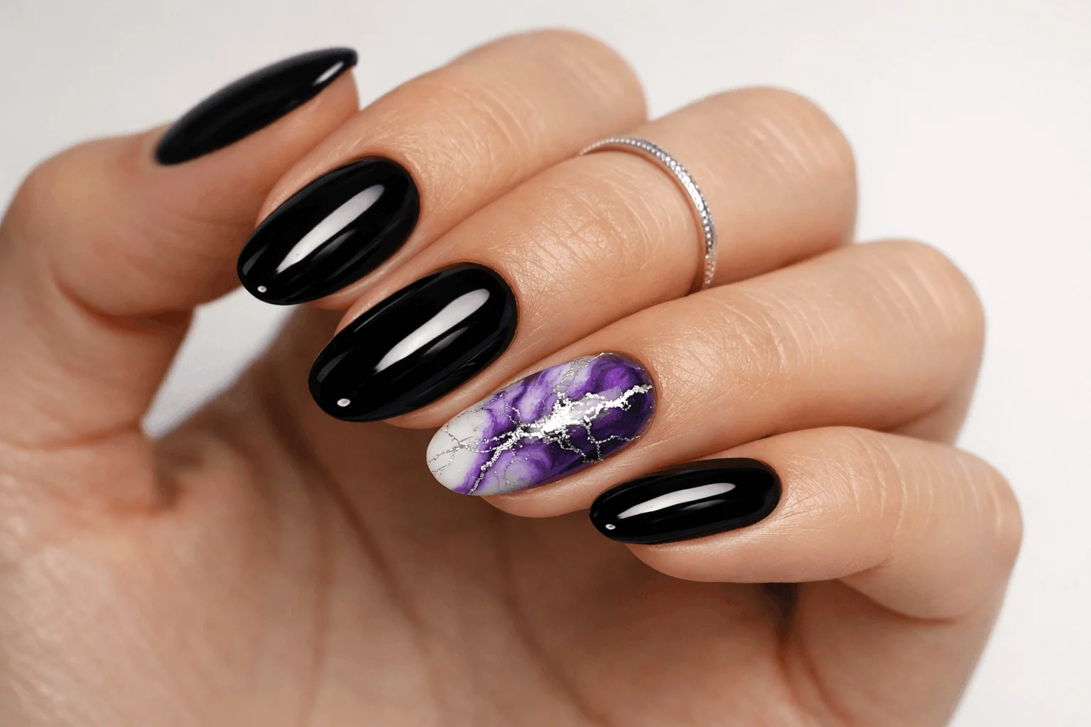 21 Black and Purple Nails Ideas That Look Expensive 5 Purple marble accent nail on glossy black manicure