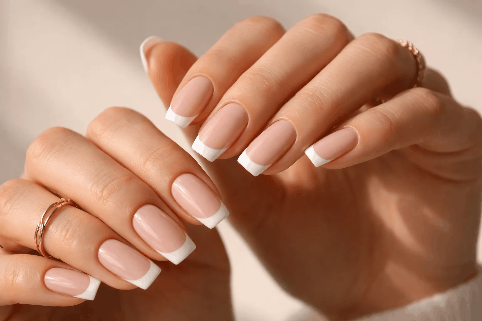 21 White French Tip Nails That Look Clean & Chic 1 White French tip nails with nude base in a clean, elegant manicure style