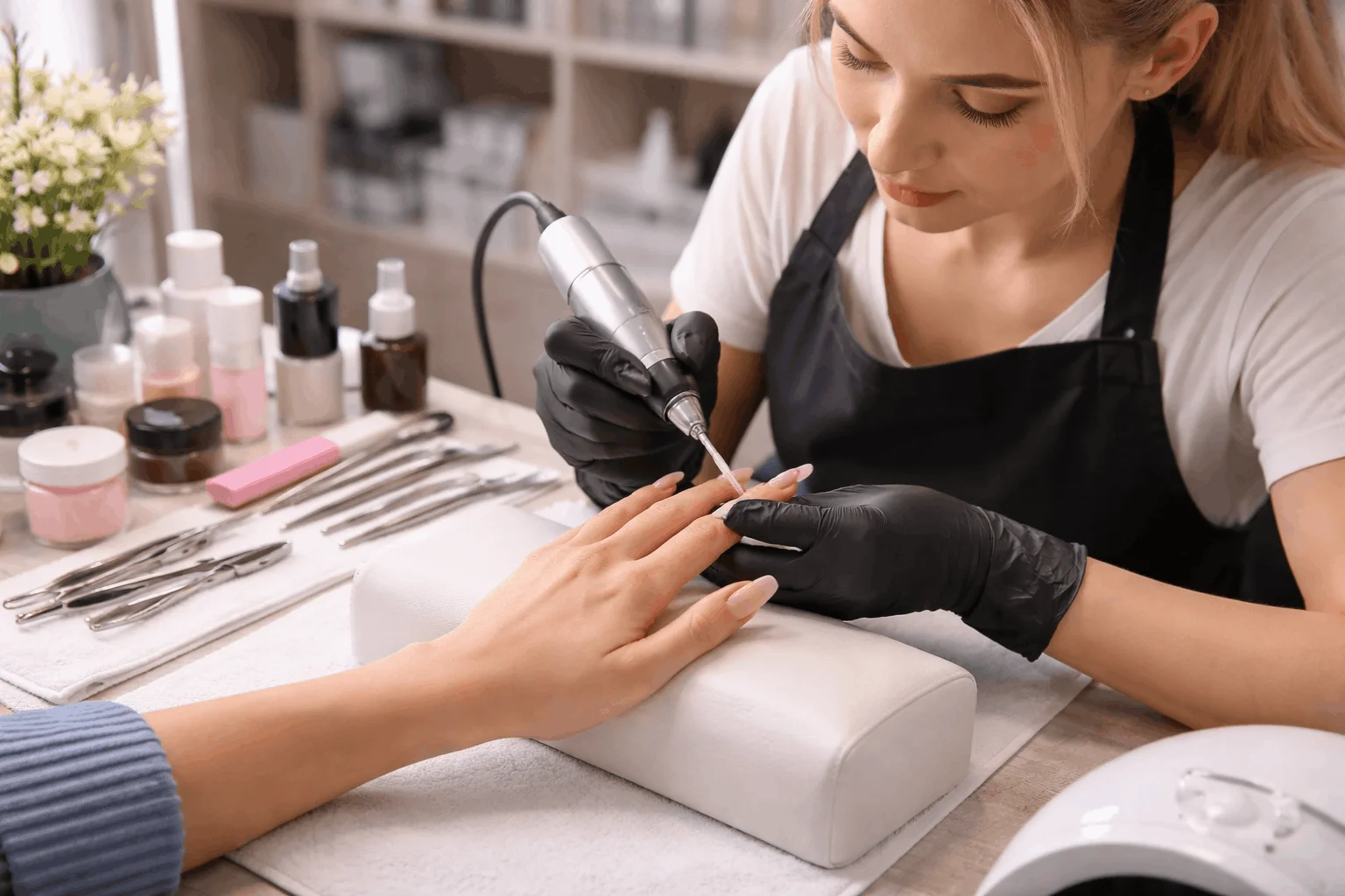 22 Facts That Explain What Are Acrylic Nails 8 nail technician shaping acrylic manicure