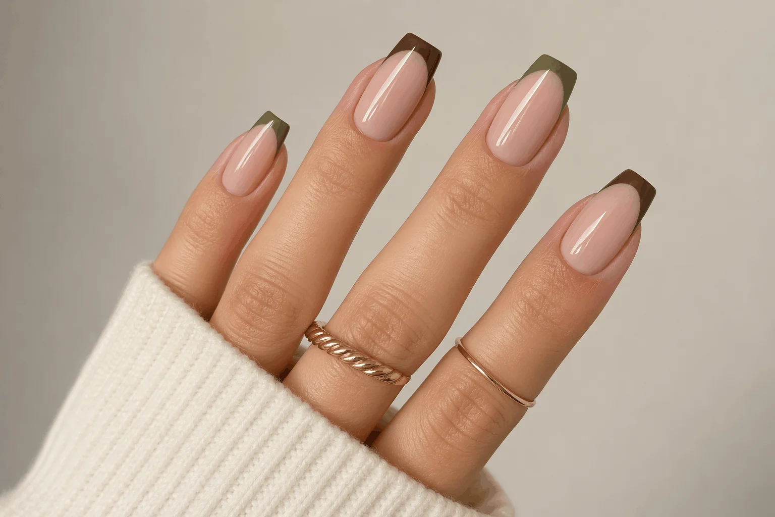 10 September Acrylic Nails That Look Stunning 4 Matte olive green acrylic nails with subtle gold accents, earthy tones, modern minimal style, soft neutral background, editorial