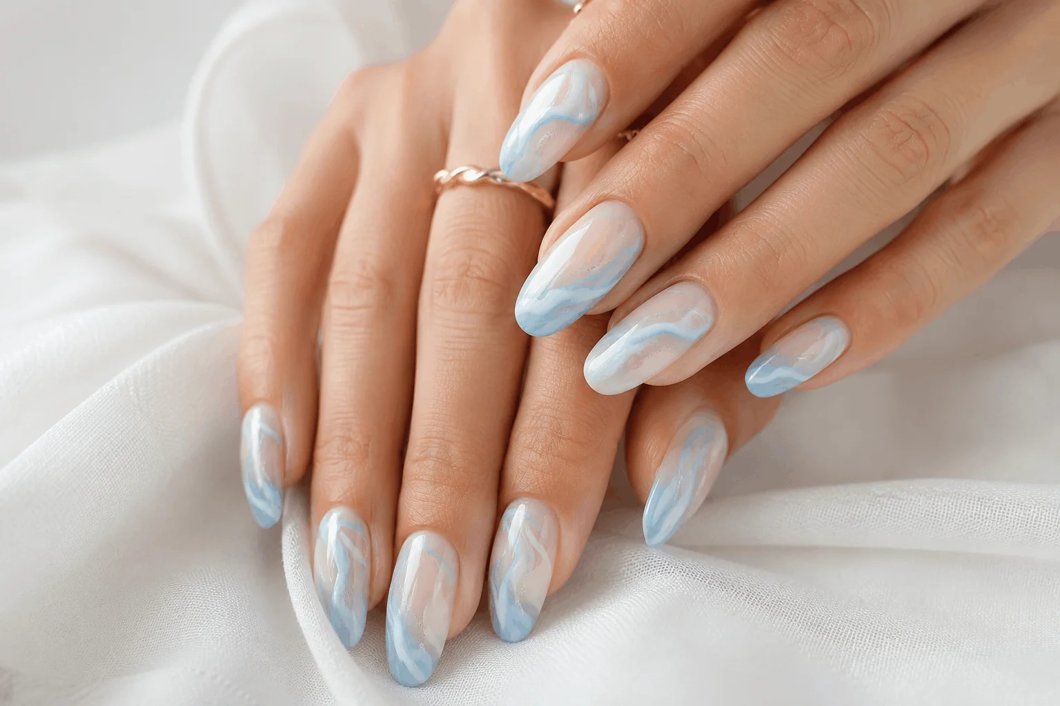 11 Light Blue Spring Nails for a Fresh New Look 6 Blue and white swirl nail art