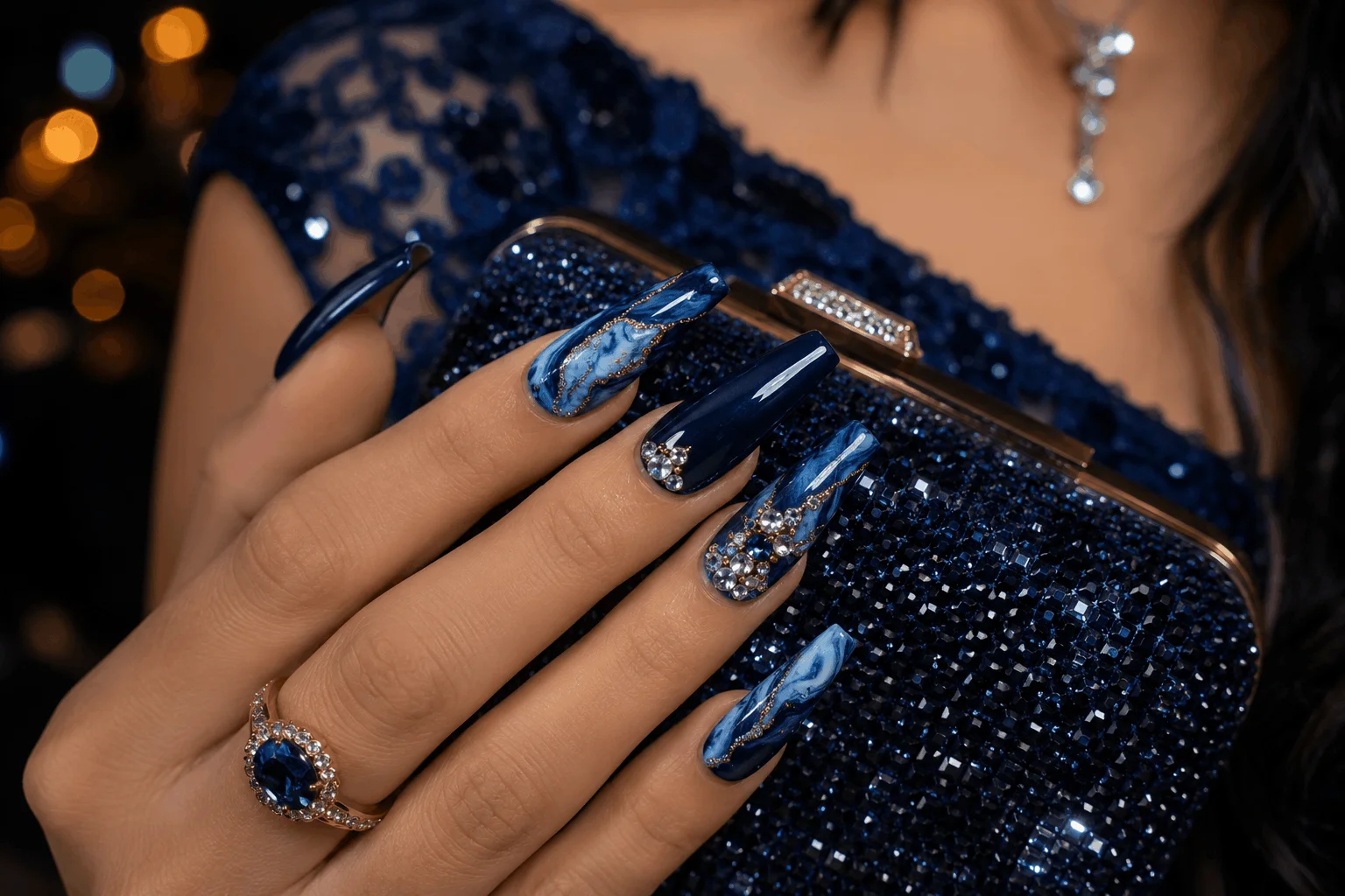 10 Blue Prom Nails That Will Steal the Spotlight Tonight 9 Blue coffin prom nails with marble and rhinestone details
