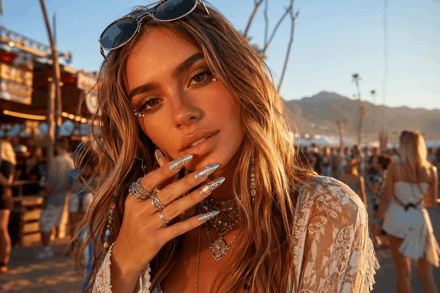 12 Coachella Nails Designs That Steal the Spotlight 11 Glamorous festival model showing trendy Coachella nails in desert setting