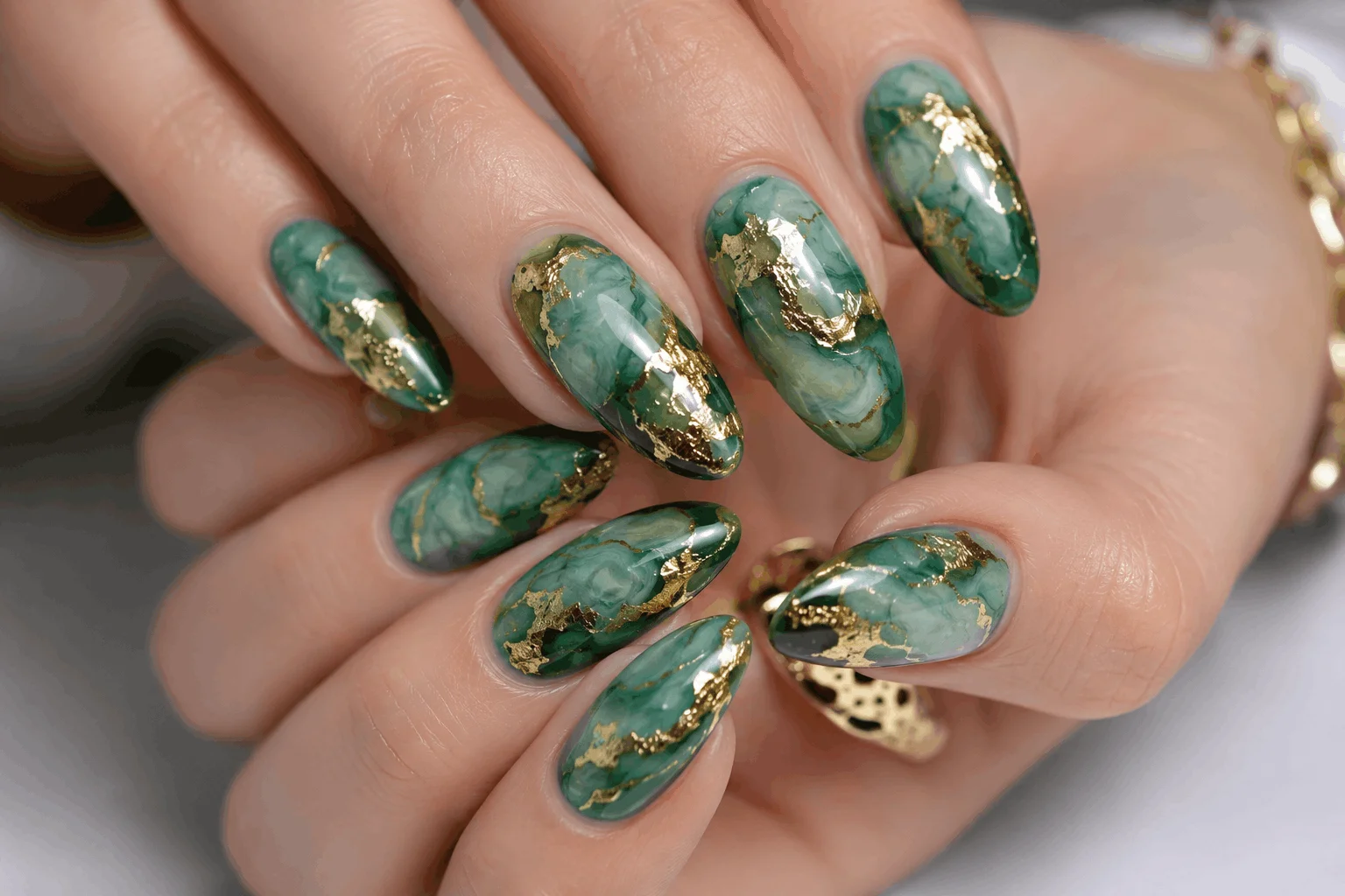 12 Saint Patricks Day Nails That Feel Extra Lucky 9 Green marble nails with gold foil accents