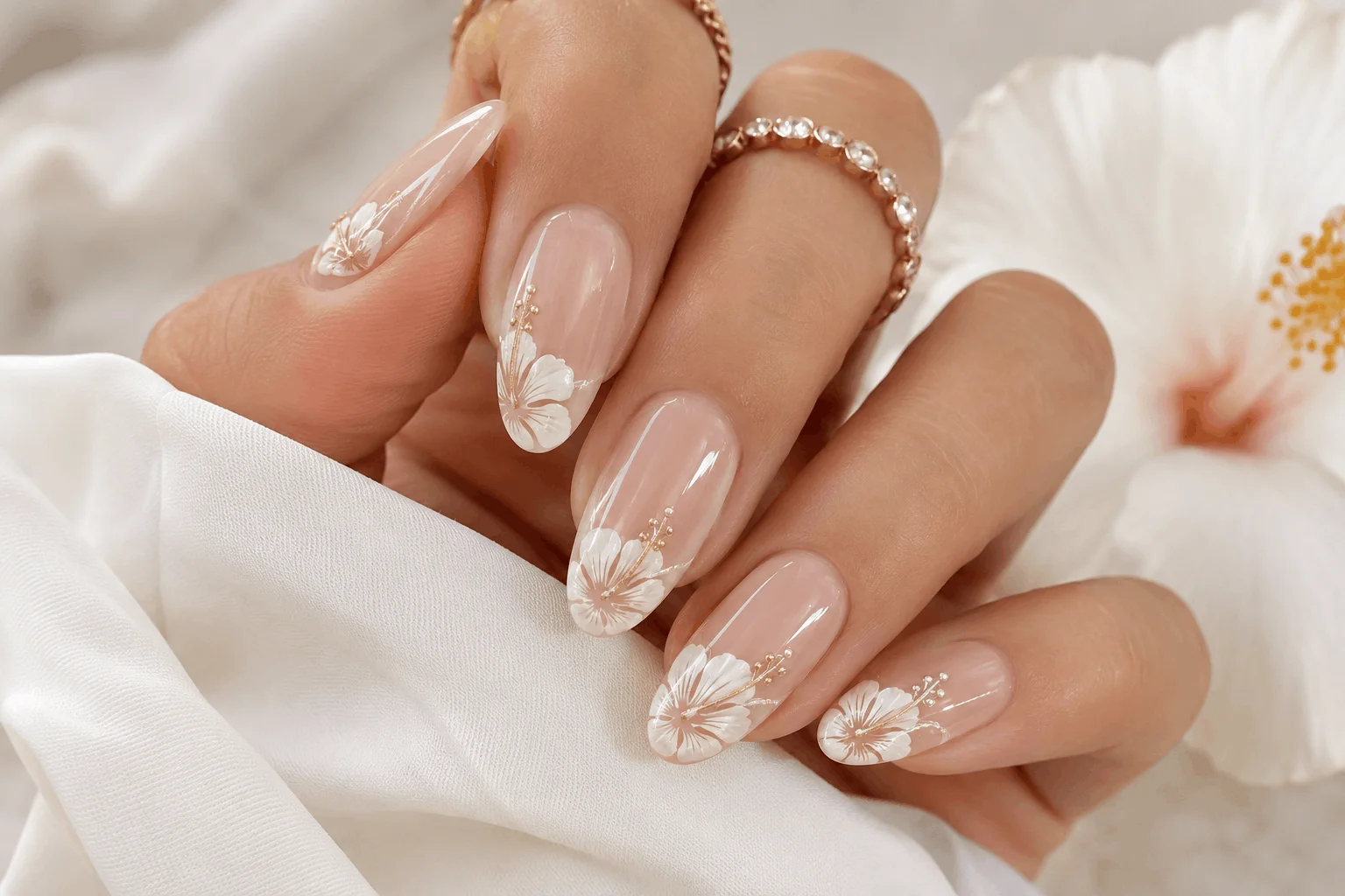 10 Summer Hibiscus Nails You’ll Want Right Away 4 Minimal white hibiscus nails with elegant nude manicure
