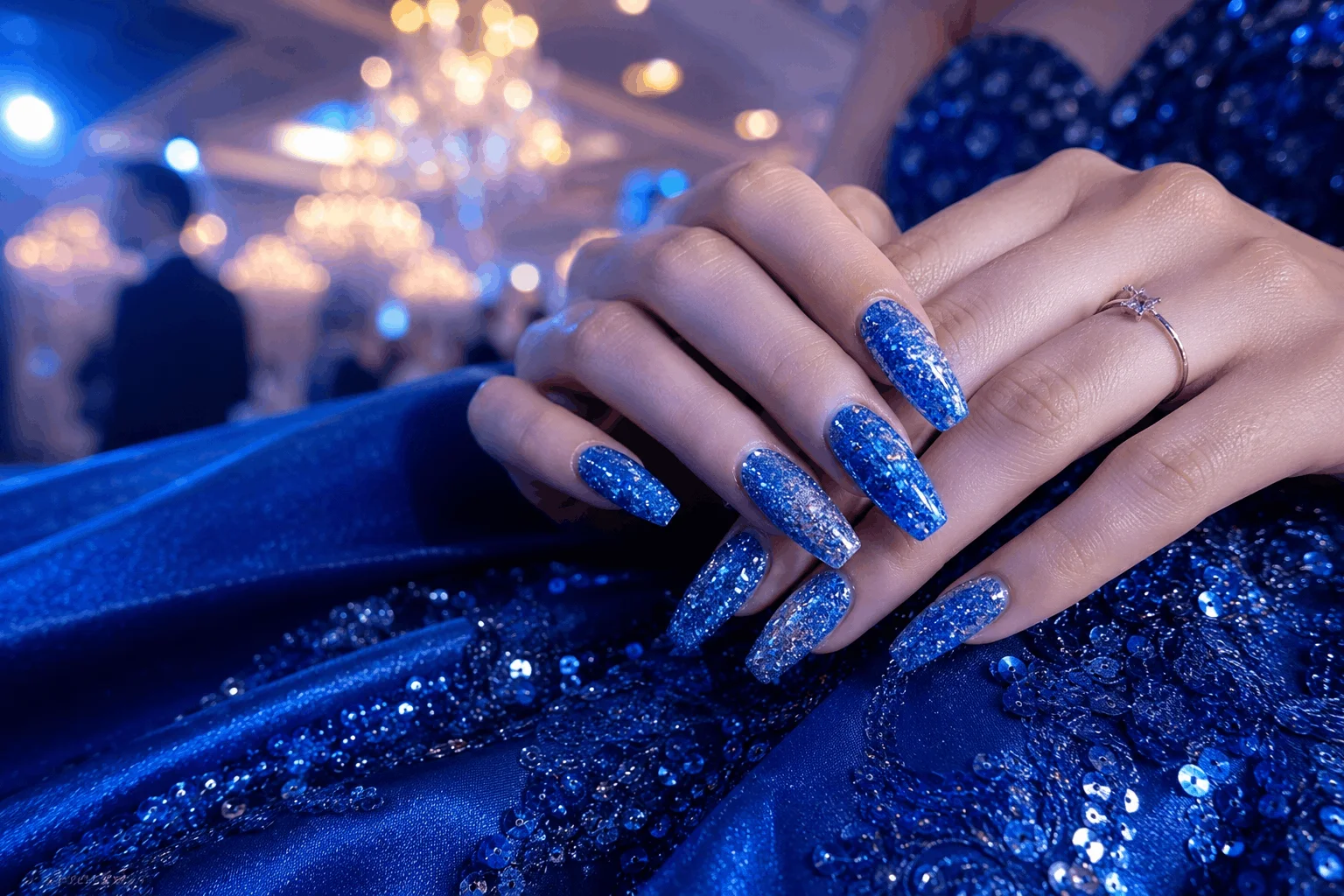 10 Blue Prom Nails That Will Steal the Spotlight Tonight 6 Sparkly blue glitter prom nails shining under party lights