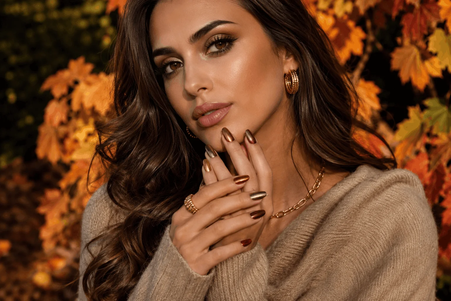 10 Fall Chrome Nails Everyone Will Copy This Season 1 Beautiful woman wearing glamorous fall chrome nails in luxurious autumn colors.