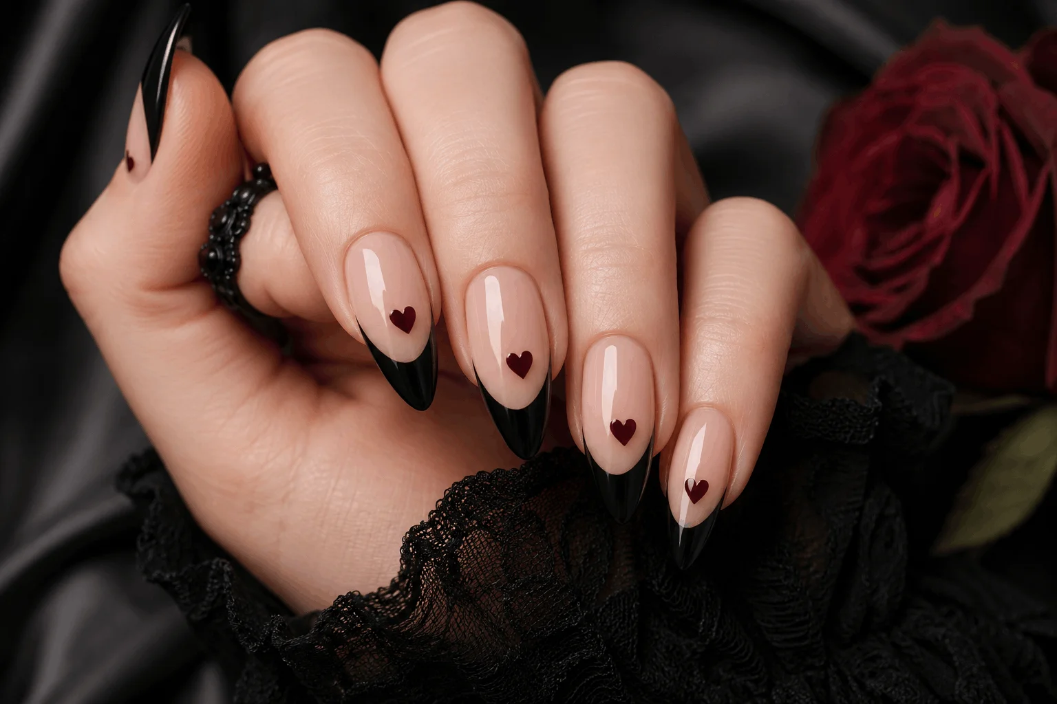10 Romantic Gothic Nails for a Bold Valentine Statement 7 Black French tip nails with dark heart accents