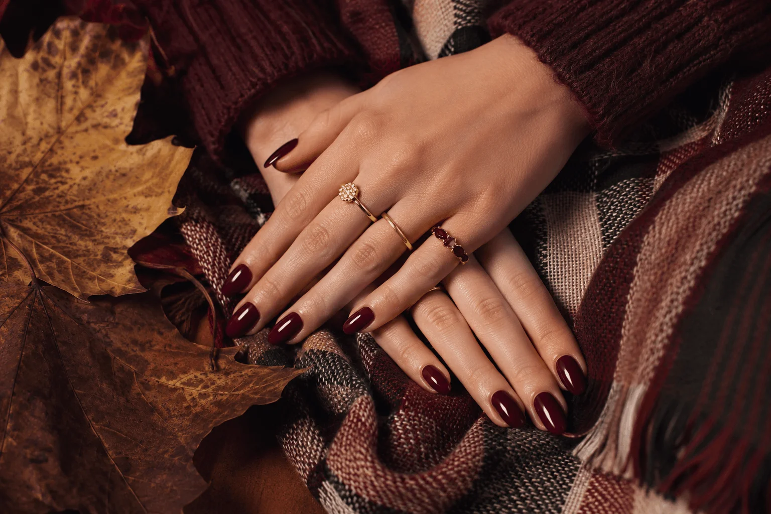 10 Fall Nail Colors Everyone Will Wear This Season 3 Deep burgundy autumn nail colors with elegant gold jewelry.