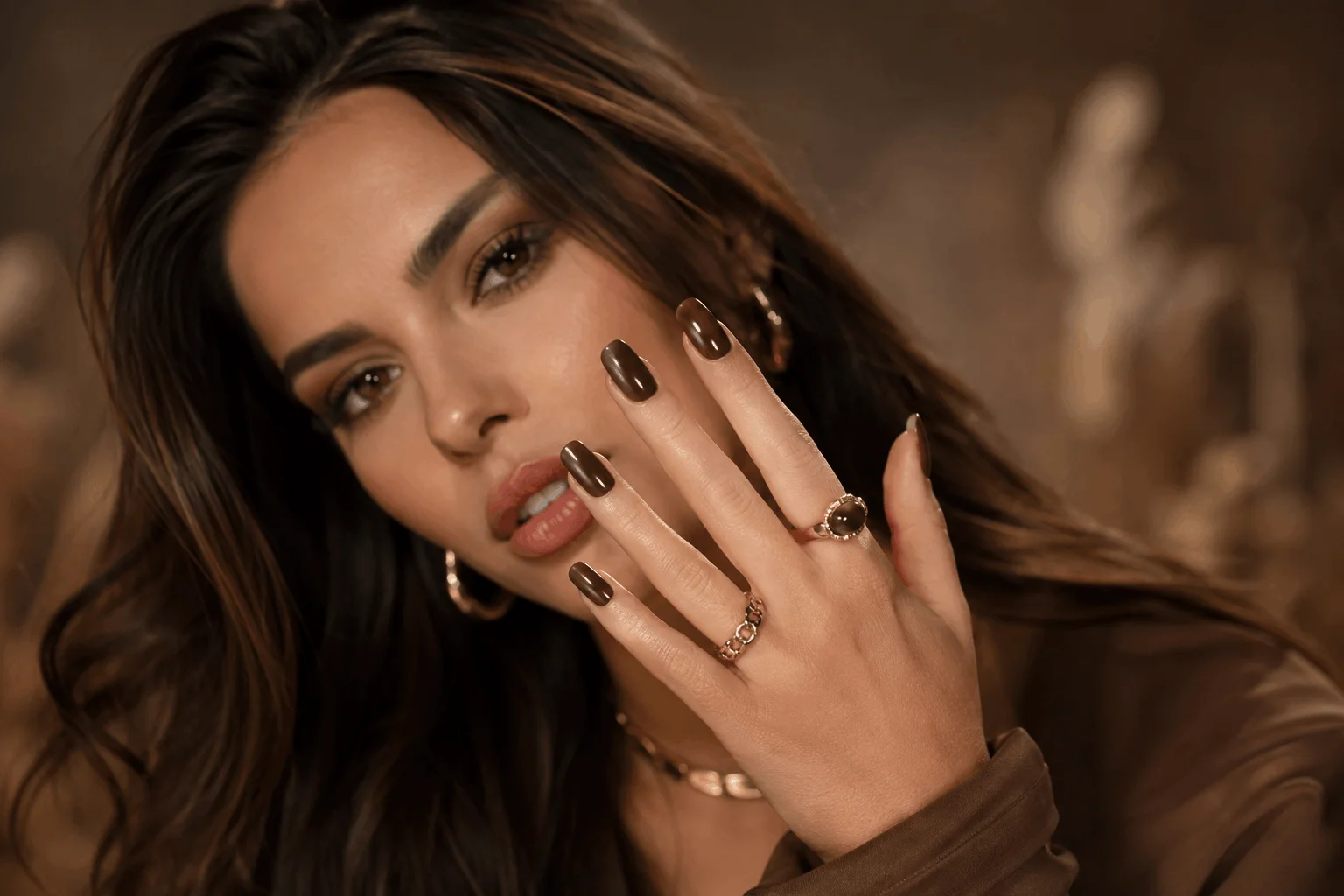 10 Brown Acrylic Nails Everyone Will Save in 2026 1 Glamorous woman showcasing trendy brown acrylic nails for 2026