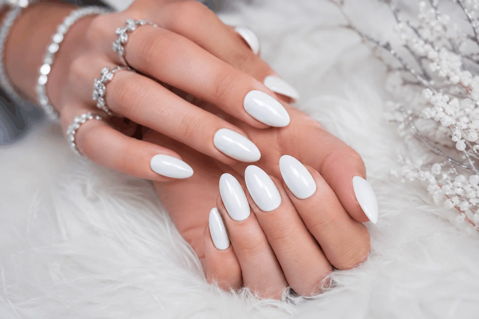 10 White Christmas Nails You'll Want This Winter 2 Glossy snow white Christmas manicure on almond-shaped nails