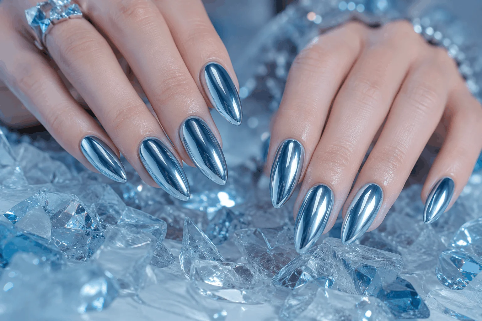10 Winter Nail Designs That Look Stunning All Winter 3 Icy blue chrome winter nails with reflective metallic shine