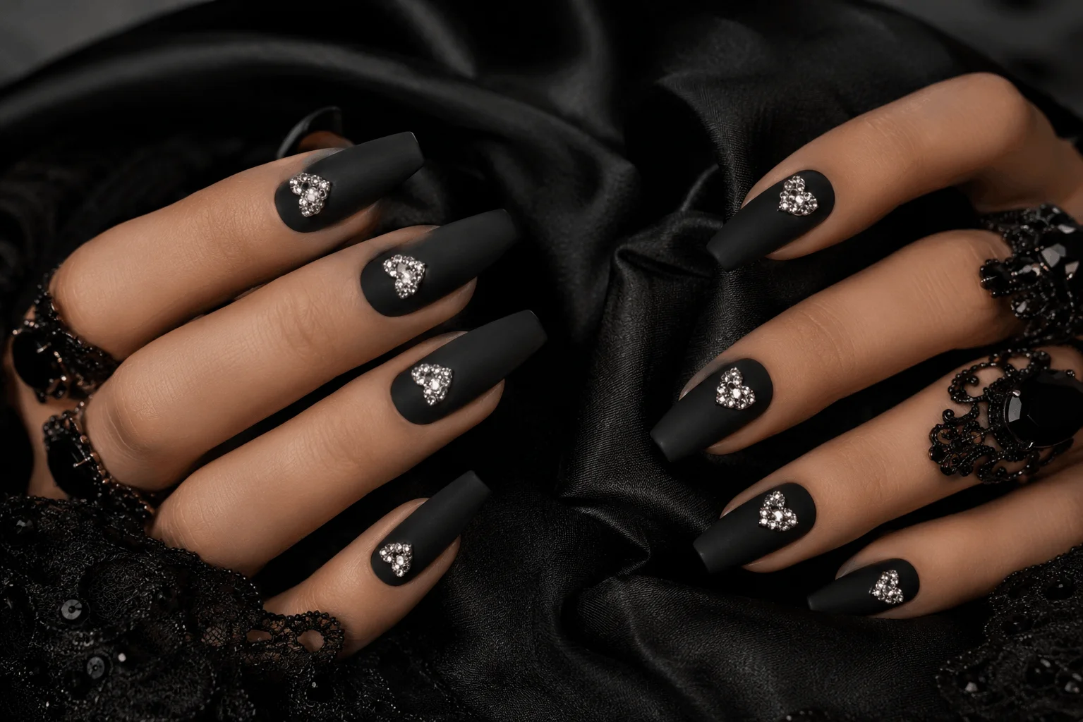 10 Romantic Gothic Nails for a Bold Valentine Statement 10 Matte black nails with crystal heart decorations