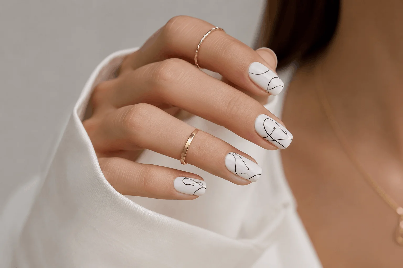 10 White Spring Nails That Scream Effortless Beauty 8 Minimalist white nails with modern line art designs