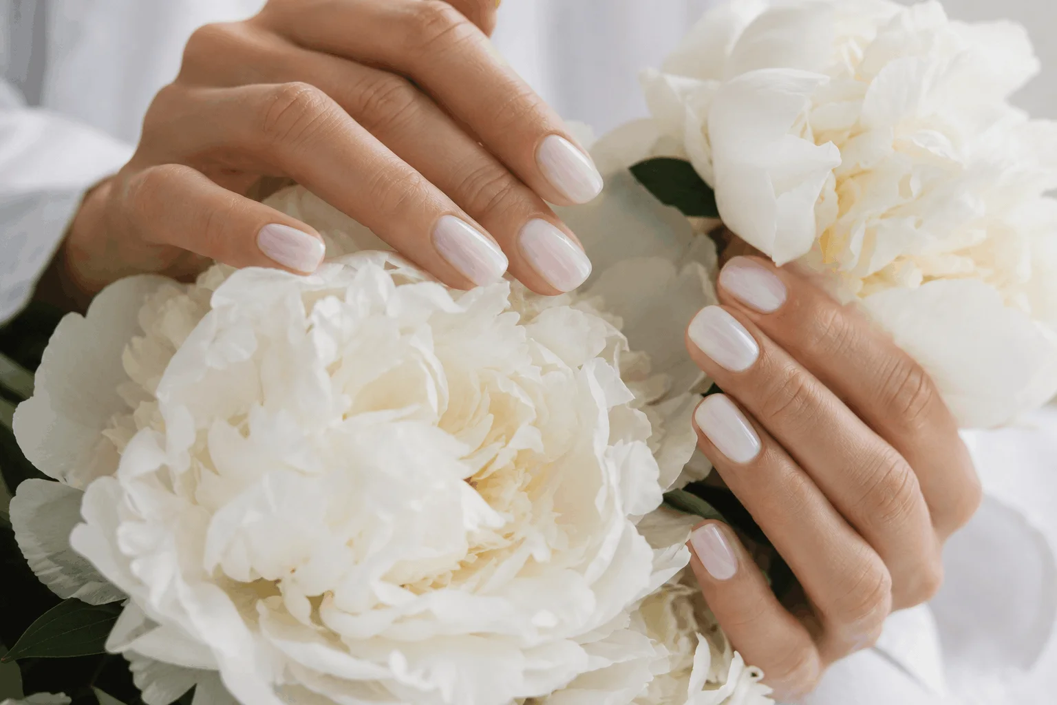 10 White Spring Nails That Scream Effortless Beauty 5 Soft milky white nails with elegant spring styling