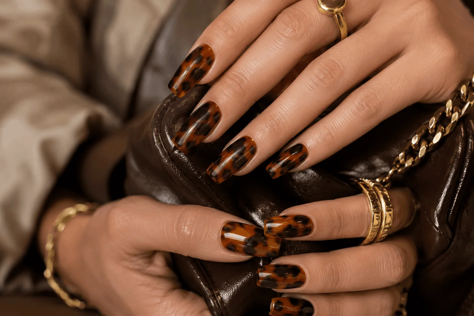 10 Brown Acrylic Nails Everyone Will Save in 2026 10 Tortoiseshell brown acrylic nails with amber patterns